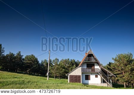 Picture Of A Vikendica Chalet Of The Mountains Of The Balkans In Summer, In Divcibare, Serbia. Divči