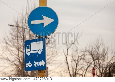 Picture Of A Roadsign Indicating The Mandatory Direction For Trucks, As Well As Carts And Tractors,o