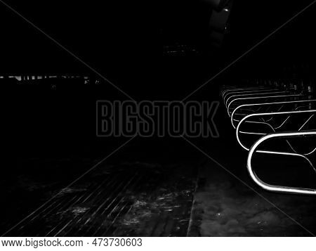 Dairy Cattle Barn Free Stall Dividers At Dark.