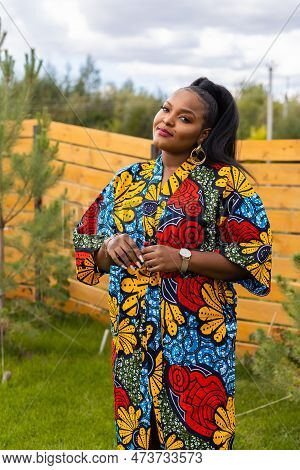 Portrait Of Beautiful African American Woman Having Fun On Village Or Suburbian. Outdoor Portrait Of