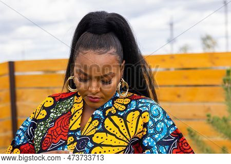 Portrait Of Beautiful African American Woman Having Fun On Village Or Suburbian. Outdoor Portrait Of