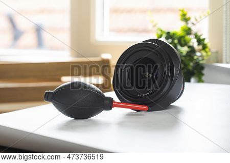 Lens On Desk With Cleaning Tools For Dslr And Mirrorless Cameras. Cleaning Kit For Cmos Surface. Air