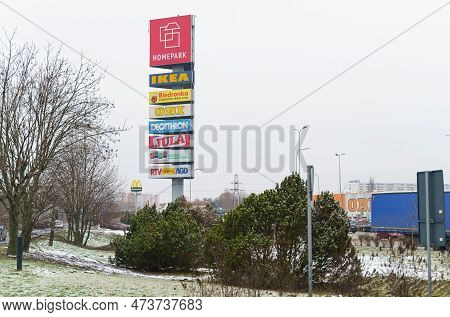 Poznan, Poland - January 25, 2023: Advertising Pointer Along The Location Of Branded Stores.