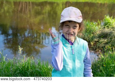 Girl Uses A Remedy For Mosquitoes And Biting Insects In Nature. Protection Of The Skin From Tick Bit