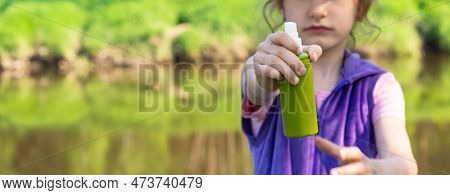Girl Uses A Remedy For Mosquitoes And Biting Insects In Nature. Protection Of The Skin From Tick Bit