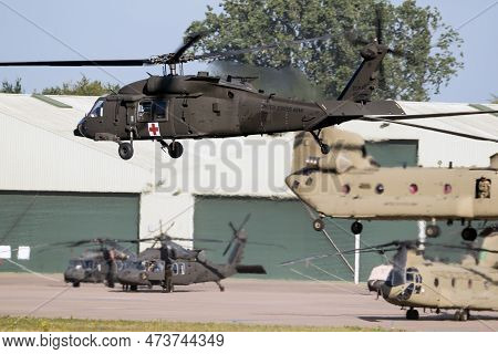 Us Army Sikorsky Hh-60m Black Hawk Helicopter Arriving At An Air Base. The Netherlands - June 22, 20