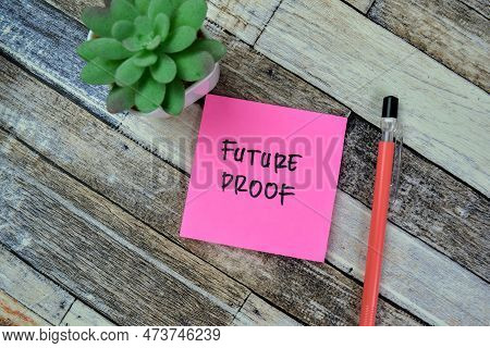 Concept Of Future Proof Write On Sticky Notes Isolated On Wooden Table.
