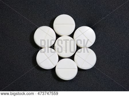 Rose Of Unspecified White Pills On A Black Background
