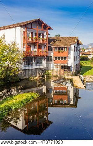 House Reflected In The Nive River In Saint-jean-pied-de-port, France