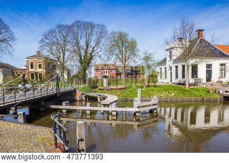Bridge Crossing The Winsumerdiep River In Historic Village Onderdendam, Netherlands