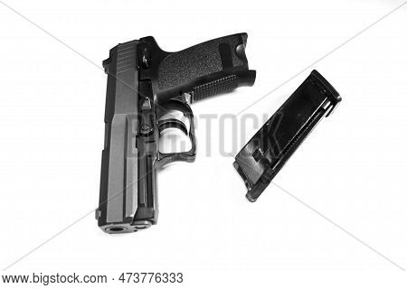 Pistol On A White Background. Game Weapons Stalker Made For The Present. Close-up Firearms.