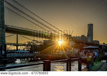 Brooklyn, Ny - Usa - March 26, 2023 Horizontal View Of The Sun Rising Over Dumbo Section Of Brooklyn