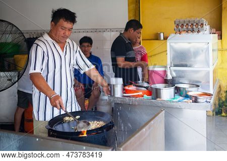 Georgetown, Penang, Malaysia - September 01, 2014: Daily Work At Fast Food Cafe At Street In Histori