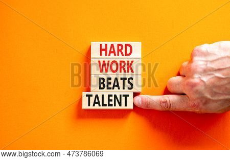 Hard Work Beats Talent Symbol. Concept Words Hard Work Beats Talent On Wooden Block. Beautiful Orang