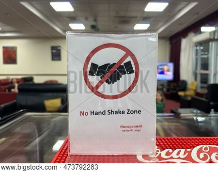 Entebbe, Uganda - March 25, 2023: Sign In The Ebb Airport Lounge For A No Handshake Zone, Leftover F