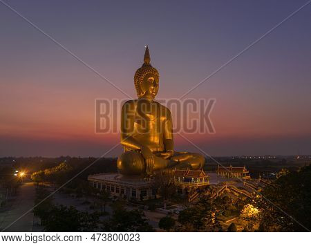 Scenery Sunset Behind The Great Golden Buddha Landmark Of Thailand At Wat Muang Ang Thong Thailand. 