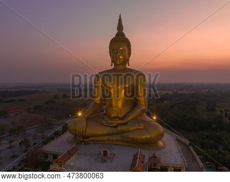 Scenery Sunset Behind The Great Golden Buddha Landmark Of Thailand At Wat Muang Ang Thong Thailand. 