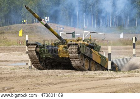 Alabino, Russia - August 19, 2022: Tank T-72b3 Overcomes The Obstacles Of The Ditch. Fragment Of The