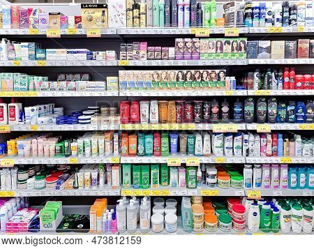 Latvia, Riga, April, 2023: Shelves With Professional Hair Care Products With Promotional Prices On S