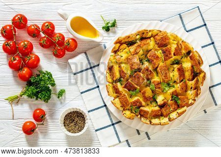 Cheesy Garlic Bread, Pull Apart Whole Round Bread On Platter On White Wood Table With Melted Butter,