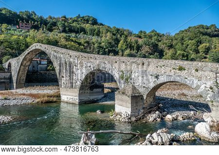 Ancient Stone Bridge, The Medieval Ponte Maddalena, Or Devils Bridge, In Tuscany, Italy