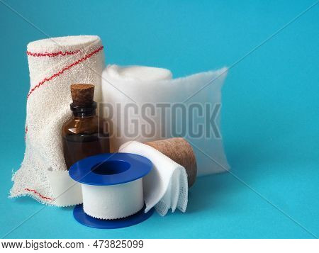 Home First Aid Kit: Dressing Materials Isolated On A Blue Background.