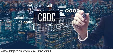 Cbdc - Central Bank Digital Currency Concept With Businessman In A City At Night