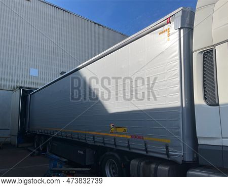 Germany - 03.20.2023: Loading Or Unloading Of Cargo In A Semi-trailer Of A Kogel Tractor On A Ramp