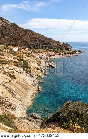 Panoramic View Over Rocky Beach Of Little Village Pomonte And Coastal Road In Autumn At Elba Island,
