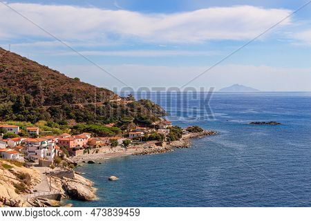 Panoramic View Over Rocky Beach Of Little Village Pomonte And Coastal Road In Autumn At Elba Island,