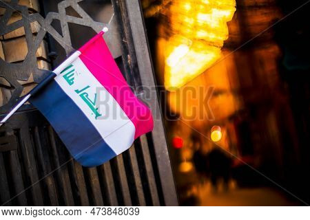 A Picture In Iraq Featuring The Iraqi Flag And Al-mutanabbi, One Of The Famous Tourist Attractions T