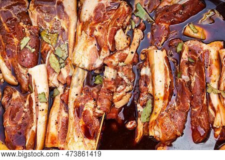 Bacon In Brine With Spices. Sliced Pork Soaked In Brine With Spices.