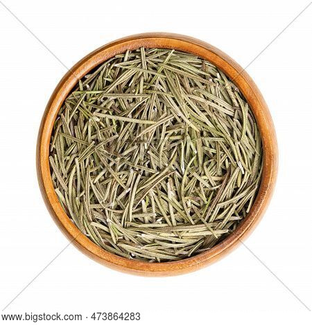 Dried Rosemary Leaves In A Wooden Bowl. Salvia Rosmarinus, An Aromatic And Evergreen Shrub, With Fra