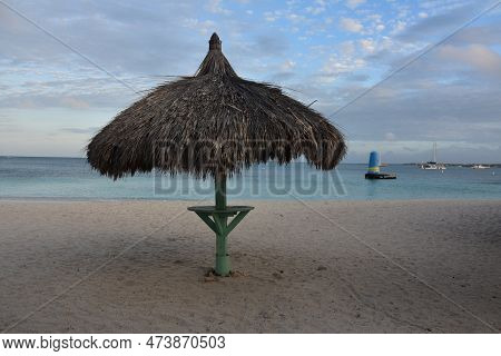 Lone Grass Beach Hut On A White Sand Beach In Aruba.