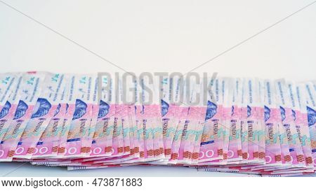 Cash Money. Ukrainian Hryvnia. Uah Currency. Closeup Of 200 Hrn Bill Pink Blue Color Paper Banknotes