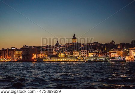 Istanbul City Skyline In Turkey, Beyoglu District Old Houses With Galata Tower On Top, View From The
