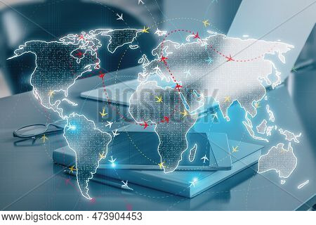 Close Up Of Workplace With Devices And Glowing Digital Map With Ariplane Connections On Blurry Backg