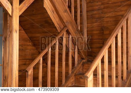 Country Wooden House Is Spacious On Two Levels. Room With Wooden Stairway Leading To Second Floor Of