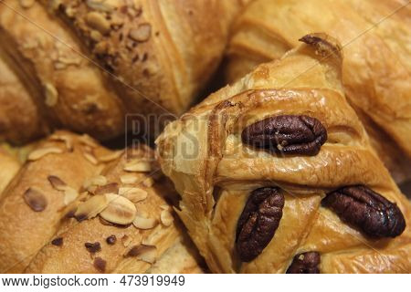 French Puff Pastry And Croissant With Toppings. Freshly Baked Sweet Buns Couple Flaky Pastry With Al