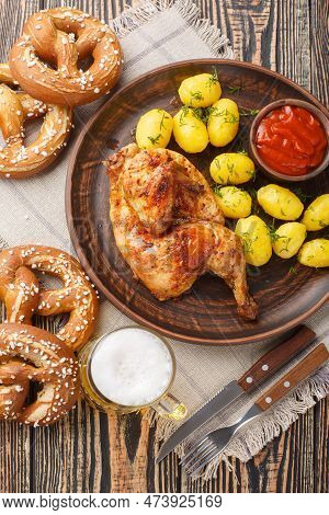 German Holiday Food Half Fried Chicken With Boiled Potatoes, Sauce, Beer And Pretzels Close-up On A 