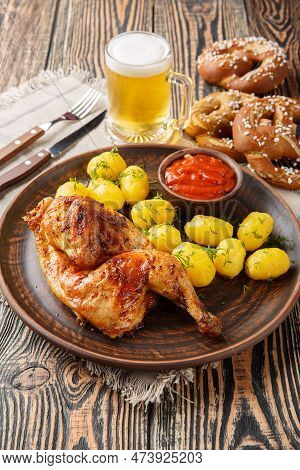 Oktoberfest Roast Chicken Wiesn Hendl With Potatoes Served With Beer And Pretzel Closeup On The Wood