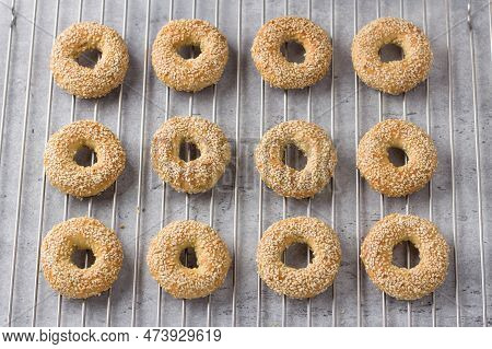 Greek Easter Cookies With Sesame Seeds Koulourakya Or Koulouria On A Wire Rack, Top View. Step By St