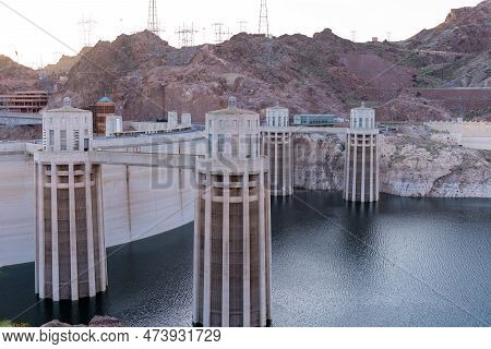 Hoover Dam Is A Concrete Arch-gravity Dam In The Black Canyon Of The Colorado River, On The Border B