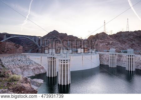 Hoover Dam Is A Concrete Arch-gravity Dam In The Black Canyon Of The Colorado River, On The Border B