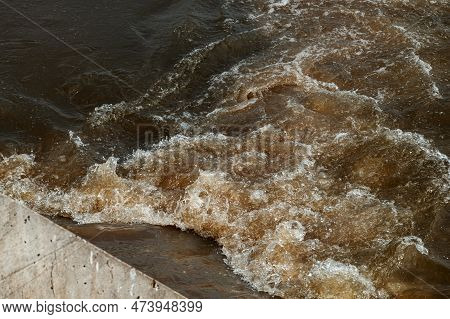 Sewage Pipe Outfall Into The River, Water Pollution And Environmental Damage Concept, Selective Focu