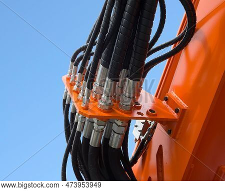 Detail Of Hydraulic Bulldozer Piston Excavator Arm Against Blue Sky