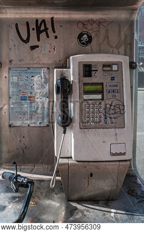 Copenhagen, Denmark - September 13, 2010: Closeup Of Soiled Public Payphone Splashed With Graffiti O