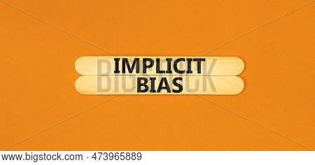 Implicit Bias Symbol. Concept Words Implicit Bias On Wooden Sticks. Beautiful Orange Table Orange Ba