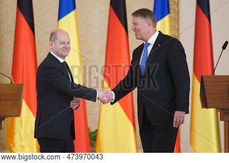 Bucharest, Romania. 3rd Apr, 2023: Olaf Scholz (l), Chancellor Of Germany, Shakes Hands With Romania