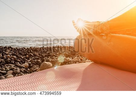 Woman Sea Yoga. Happy Woman In White Swimsuit And Boho Style Braclets Practicing Outdoors On Yoga Ma